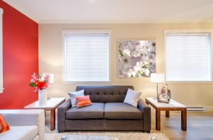 A modern living room with a red wall