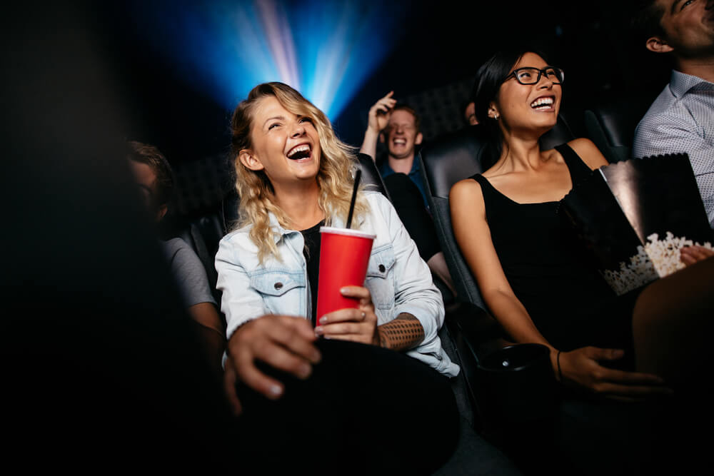 friends watching film in cinema