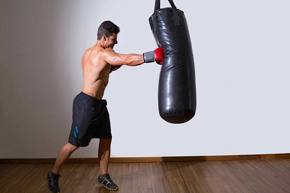 man with punch bag