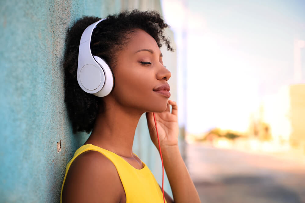 woman listening to music on headphones