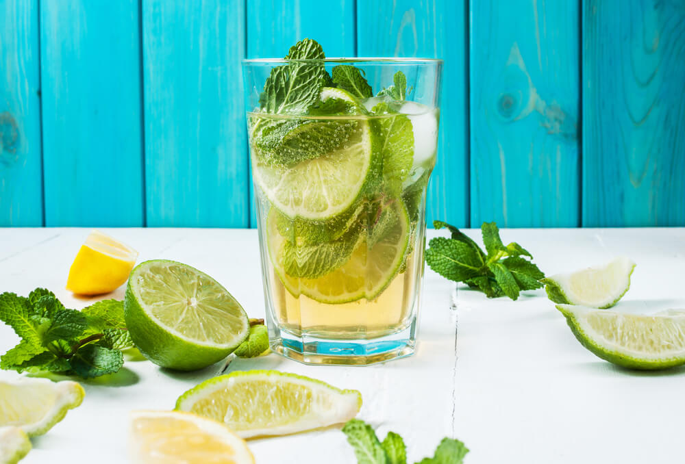 Mojito in a glass with blue wood background 