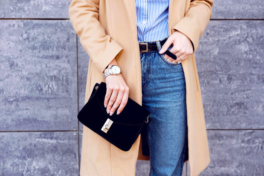 Holding a black purse