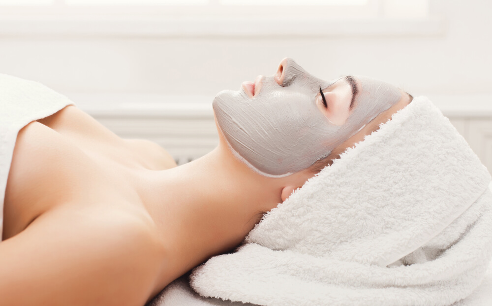 Woman with clay face mask