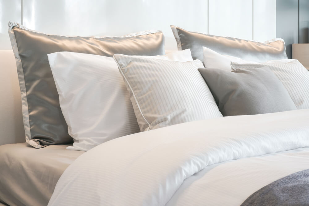 Satin pillowcases on bed