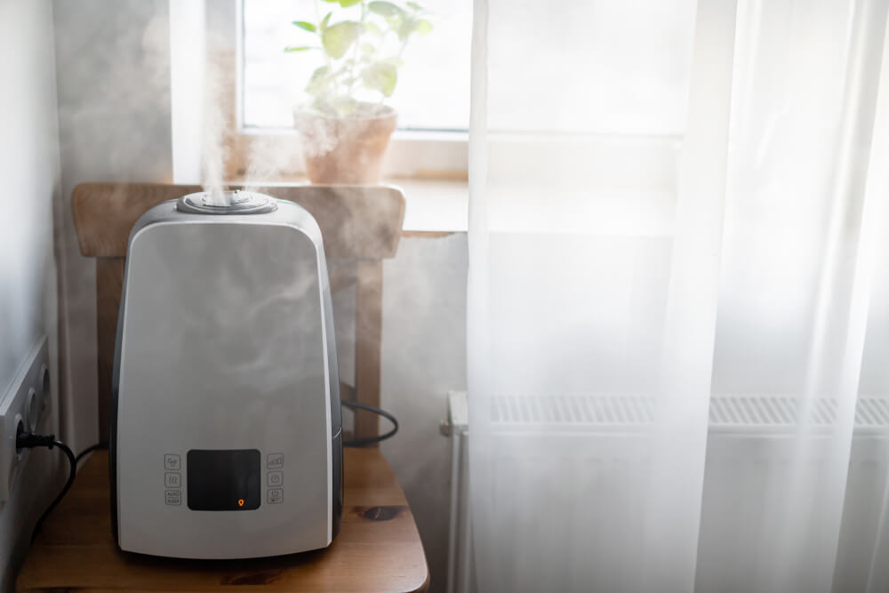 Humidifier on table by window