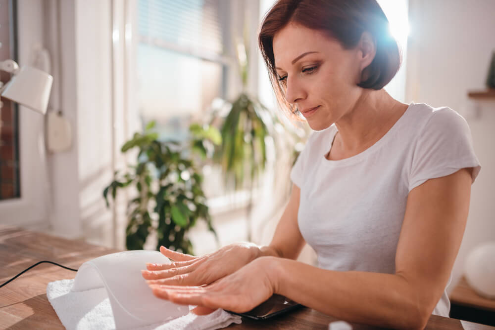 Woman looking at nails