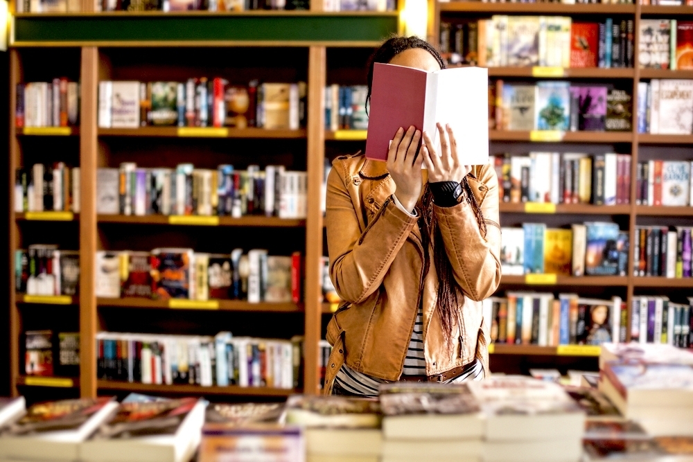 Woman reading in a bookstore