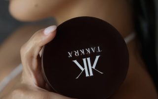 Woman holding Takkra hair mask