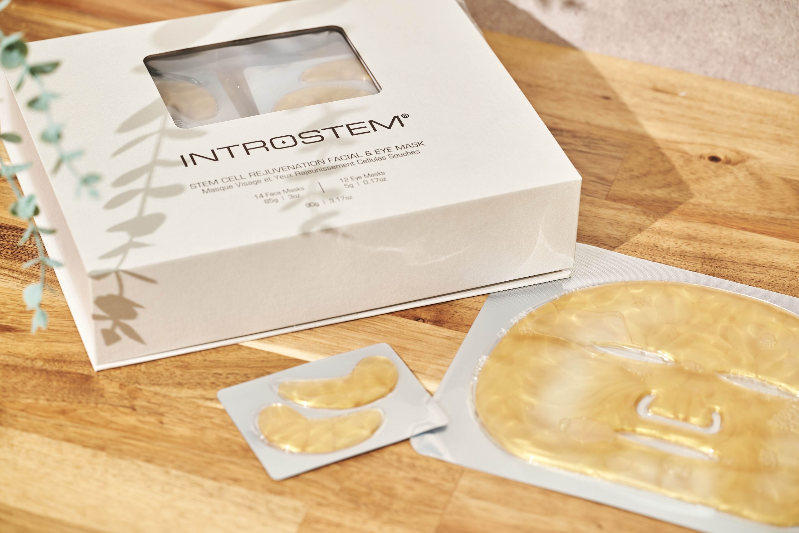 Introstem Stem Cell Rejuvenation Face and Eye Masks box plus masks next to it on table