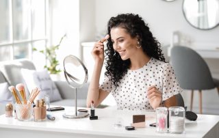 Woman with dry skin applying makeup using the underpainting technique