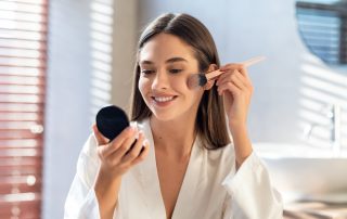 Woman applying makeup